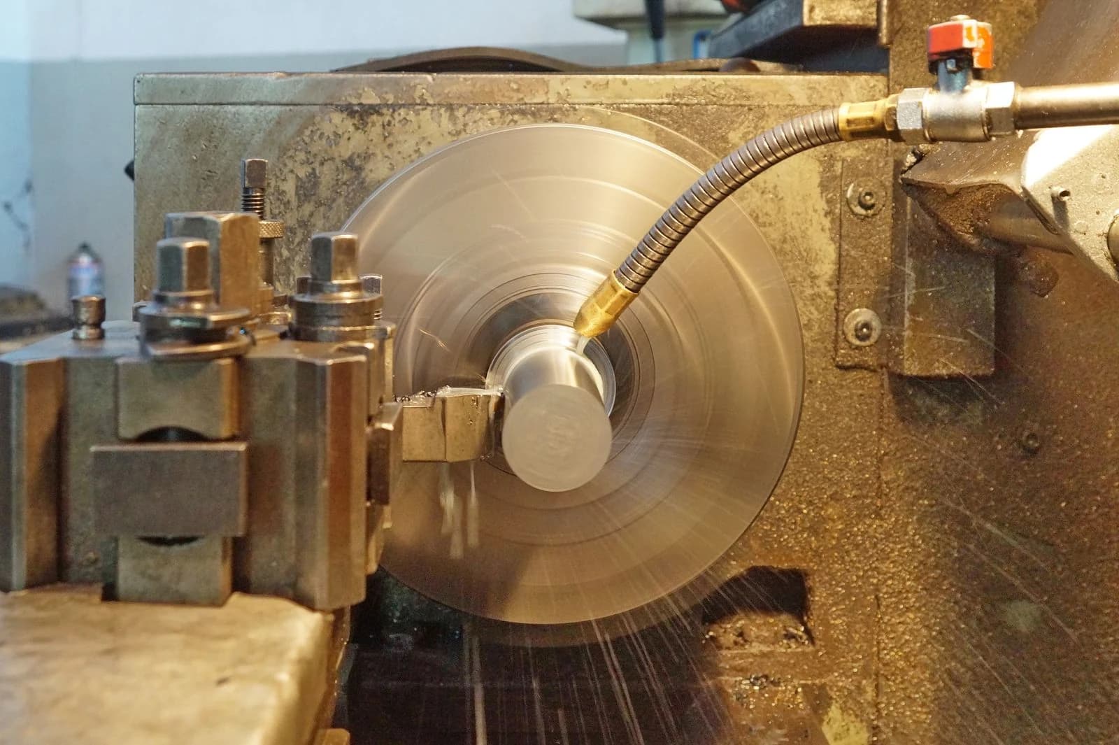 A round part being turned on a lathe, revolved from a half-section