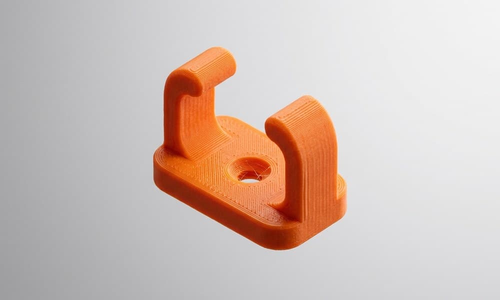A flat 3D-printed cable clip modelled in Tinkercad