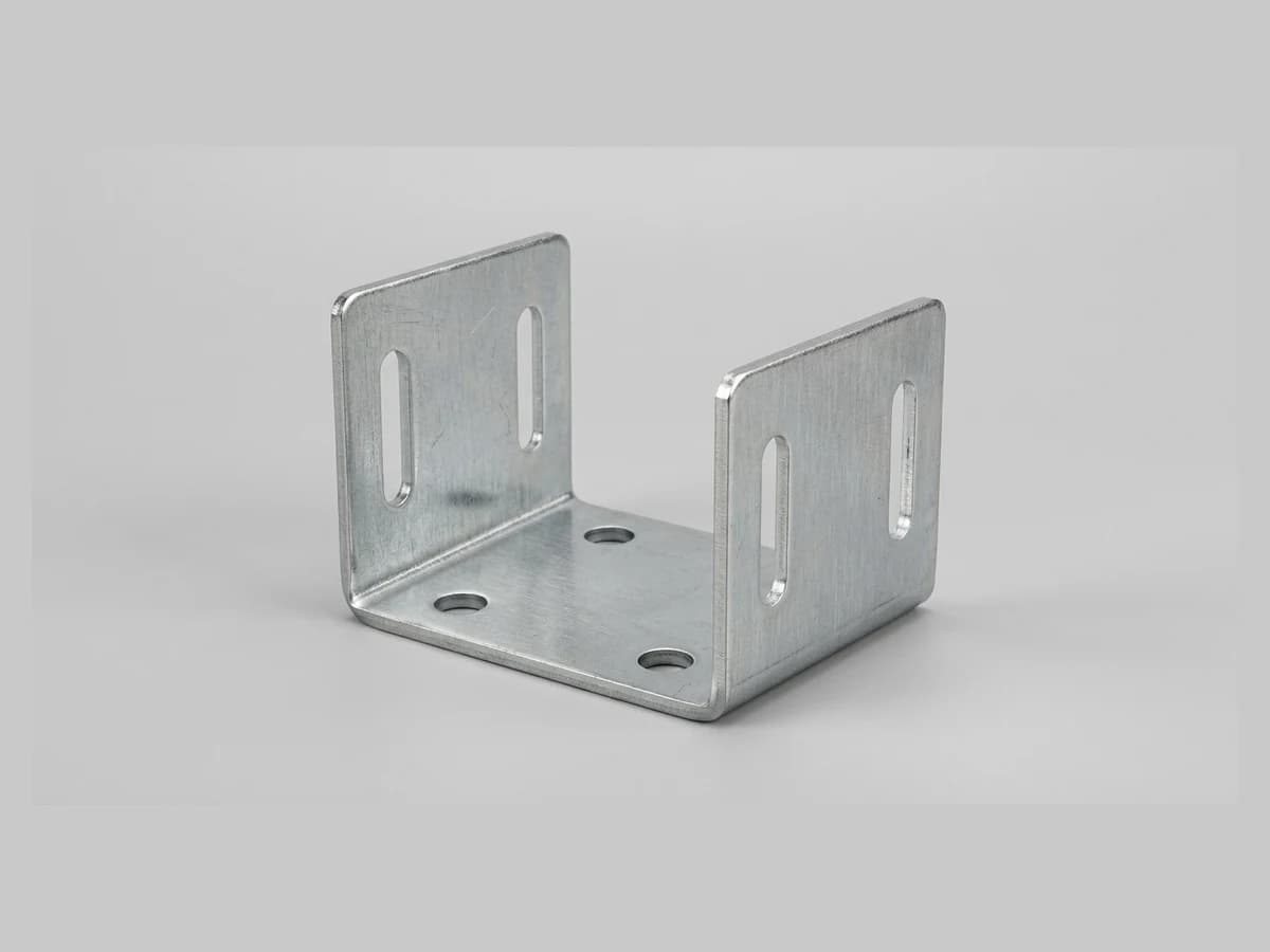 A bent sheet steel mounting bracket photographed on a plain background, ready to upload